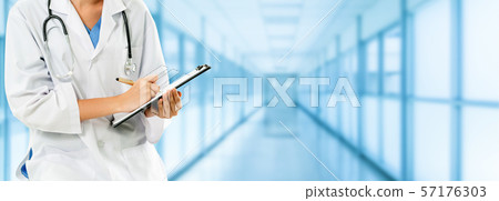 Woman doctor working at the hospital office. Woman doctor working at the hospital office. 57176303