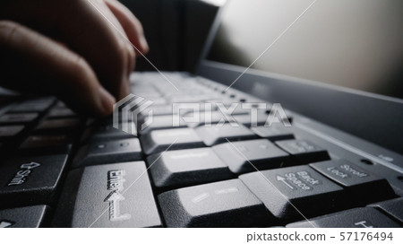 Close-up soft-focus finger typing on keyboard. Close-up soft-focus finger typing on keyboard. 57176494