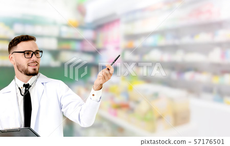 Pharmacist pointing at empty space for your text. Pharmacist pointing at empty space for your text. 57176501