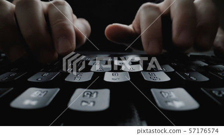 Close-up soft-focus finger typing on keyboard. Close-up soft-focus finger typing on keyboard. 57176574