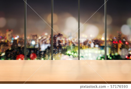 Wood table in city center modern office background Wood table in city center modern office background 57176593