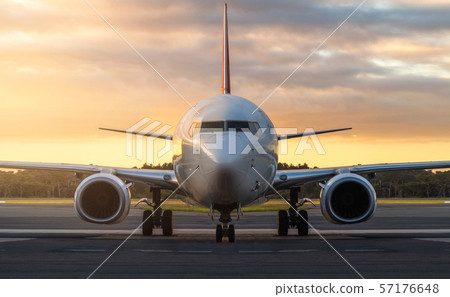 Airplane on Airport Runway at Sunset in Tasmania 57176648