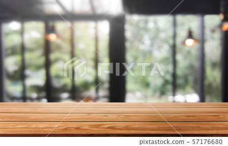 Wood table in blur background of modern restaurant 57176680