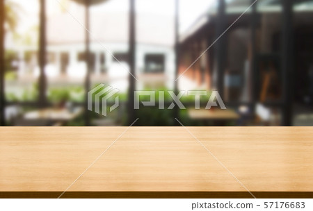 Wood table in blur background of modern restaurant 57176683