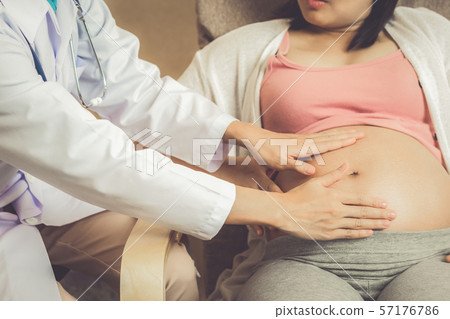 Pregnant Woman and Gynecologist Doctor at Hospital Pregnant Woman and Gynecologist Doctor at Hospital 57176786