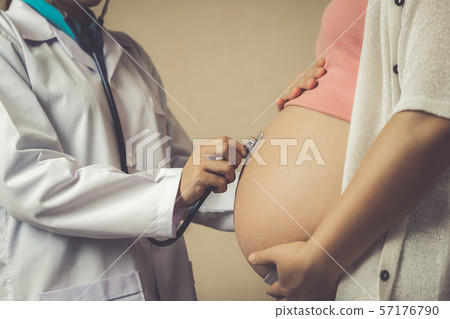 Pregnant Woman and Gynecologist Doctor at Hospital Pregnant Woman and Gynecologist Doctor at Hospital 57176790