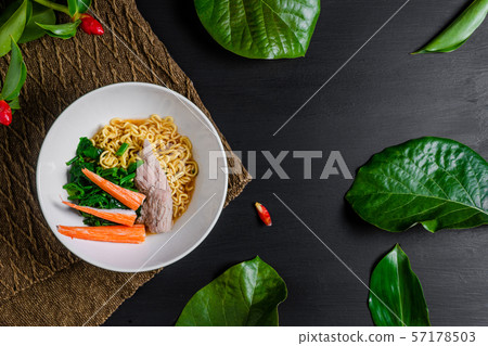 Spicy instant noodles with beef and crab sticks. Spicy instant noodles with beef and crab sticks. 57178503