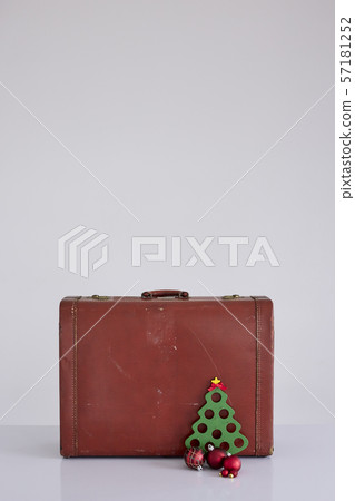 Vintage suitcase with Christmas decorations on 57181252