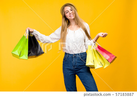 Caucasian teenage girl on yellow background. Caucasian teenage girl on yellow background. 57183887