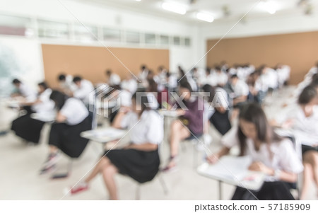 Blur school background university students writing answer doing exam in classroom .. Blur school background university students writing answer doing exam in classroom .. 57185909