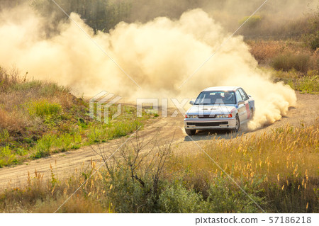 Sports Car on a Bend and a lot of Dust 03 57186218