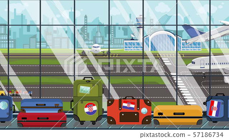 Baggage with Croatian flag stickers on baggage carousel in airport. Tourism in Croatia conceptual Baggage with Croatian flag stickers on baggage carousel in airport. Tourism in Croatia conceptual 57186734