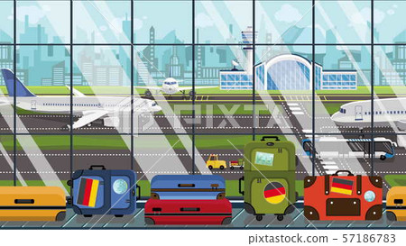 Luggage with Gegman flag stickers on baggage carousel in airport. Tourism in Germany conceptual 57186783