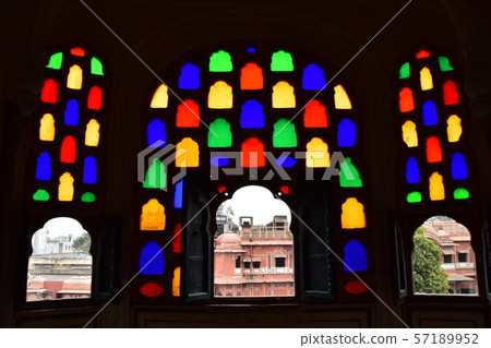 Inside of Jaipur, India-style palace, beautiful stained glass and view from room window, pink cityscape 57189952