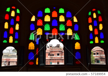Inside of Jaipur, India-style palace, beautiful stained glass and view from room window, pink cityscape 57189954
