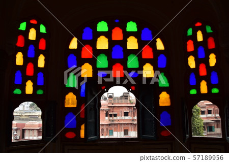 Inside of Jaipur, India-style palace, beautiful stained glass and view from room window, pink cityscape 57189956