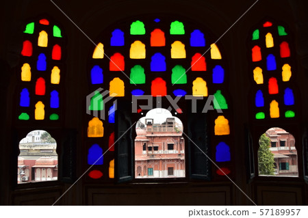 Inside of Jaipur, India-style palace, beautiful stained glass and view from room window, pink cityscape 57189957