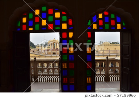 Indian Jaipur-style palace room with beautiful stained glass and door view 57189960