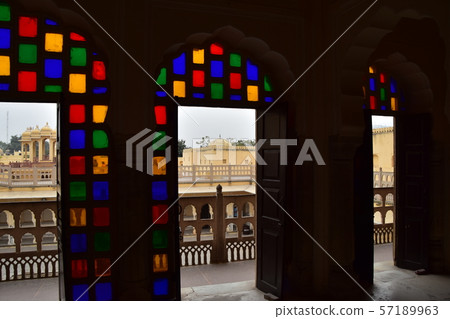 Indian Jaipur-style palace room with beautiful stained glass and door view 57189963