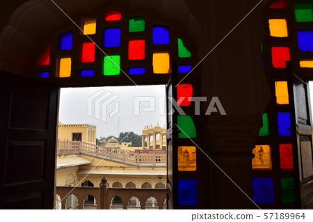 Indian Jaipur-style palace room with beautiful stained glass and door view 57189964
