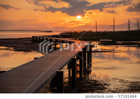 Notsuke peninsula wooden path and sunset Notsuke peninsula wooden path and sunset 57191484