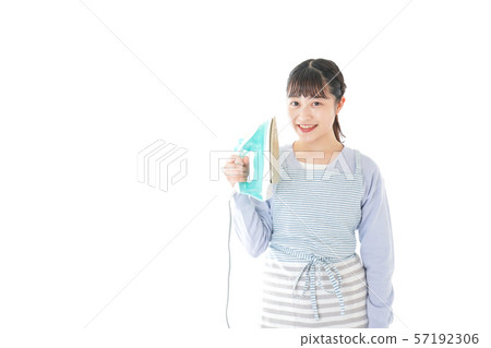 Young housewife ironing 57192306
