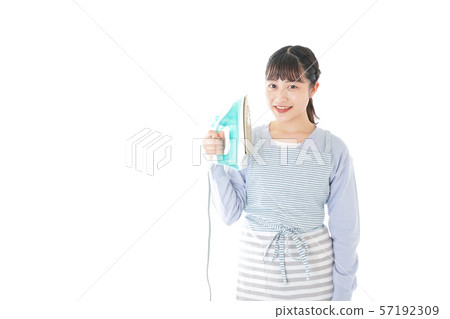 Young housewife ironing Young housewife ironing 57192309