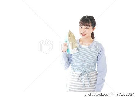 Young housewife ironing 57192324