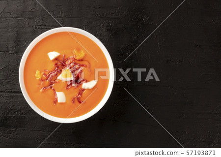 Salmorejo, Spanish cold tomato soup, overhead shot on a black background with a place for text 57193871