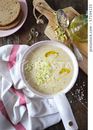 Oaten soup with grated cheese and leek 57194133