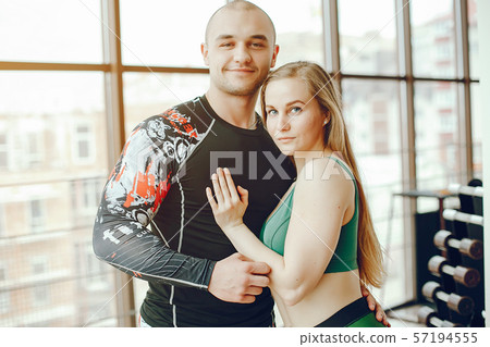 sporty couple in a gym sporty couple in a gym 57194555