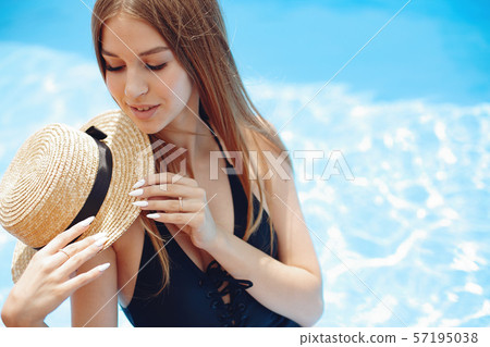 Girl on summer party in the swimming pool Girl on summer party in the swimming pool 57195038