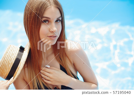 Girl on summer party in the swimming pool Girl on summer party in the swimming pool 57195040