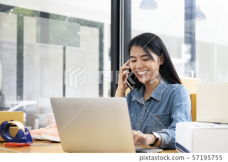 Online small business owner checking order. 57195755