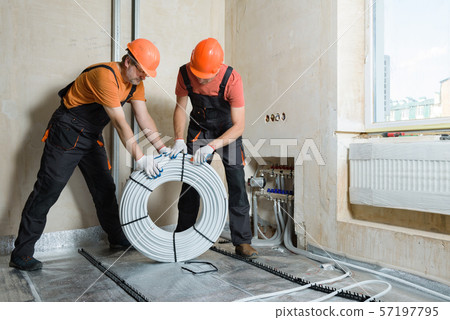 Installation of a warm floor. Installation of a warm floor. 57197795