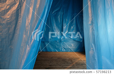 blue canvas around wooden brown floor at a crime scene blue canvas around wooden brown floor at a crime scene 57198213