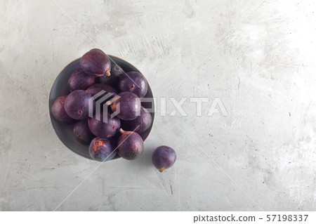 Fresh figs in a bowl on a gray wood background, 57198337