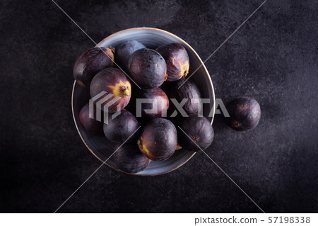 Fresh figs in a bowl on a dark wood background, 57198338