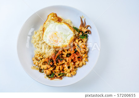 Spicy stir fried squid with basil leaves and Spicy stir fried squid with basil leaves and 57200655