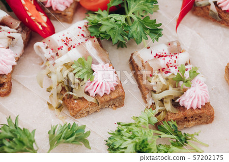 Appetizing sandwich with bacon decorating greenery 57202175