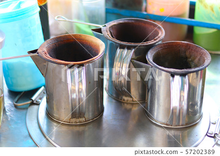 Traditional stainless jug for preparing hot and iced coffee - traditional coffee drink jug - fresh coffee drink jug Traditional stainless jug for preparing hot and iced coffee - traditional coffee drink jug - fresh coffee drink jug 57202389