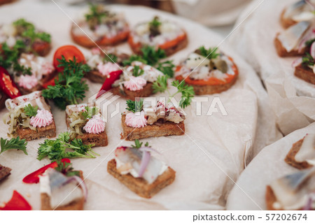 Delicious sandwiches with herring and onion.Close Delicious sandwiches with herring and onion.Close 57202674
