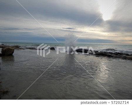 Wave breaks on the rocks. Wave breaks on the rocks. 57202714