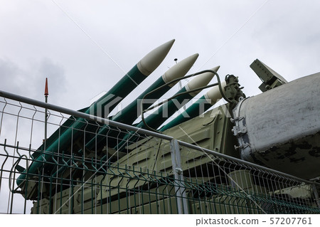 Missile launch rocket launcher behind fencing at a military base for hitting air targets Missile launch rocket launcher behind fencing at a military base for hitting air targets 57207761