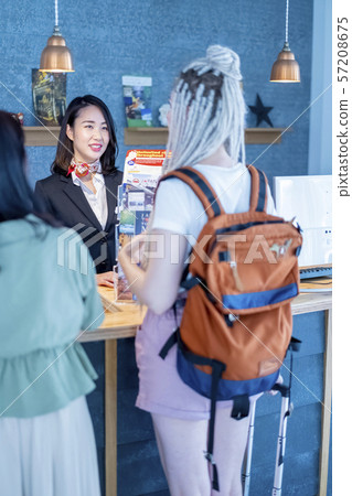 Hospitality female tourist guide staff smiling foreign tourists 57208675