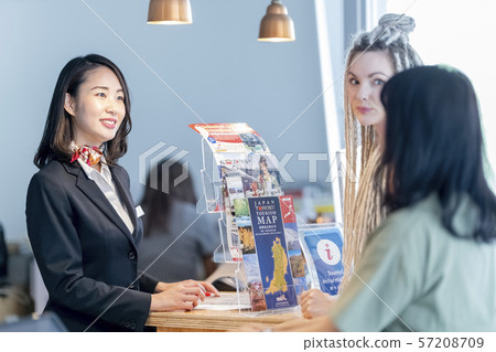 Hospitality female tourist guide staff smiling foreign tourists 57208709