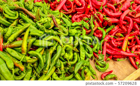 Pointed red and green peppers, in vivid contrast Pointed red and green peppers, in vivid contrast 57209628