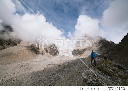 Tourist in the mountains of the Caucasian range Tourist in the mountains of the Caucasian range 57210150
