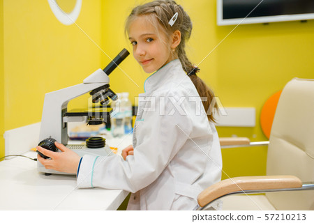 Girl at the microscope, playing doctor, playroom 57210213