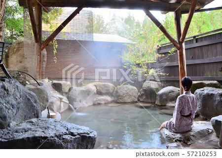 A woman in an open-air bath 57210253
